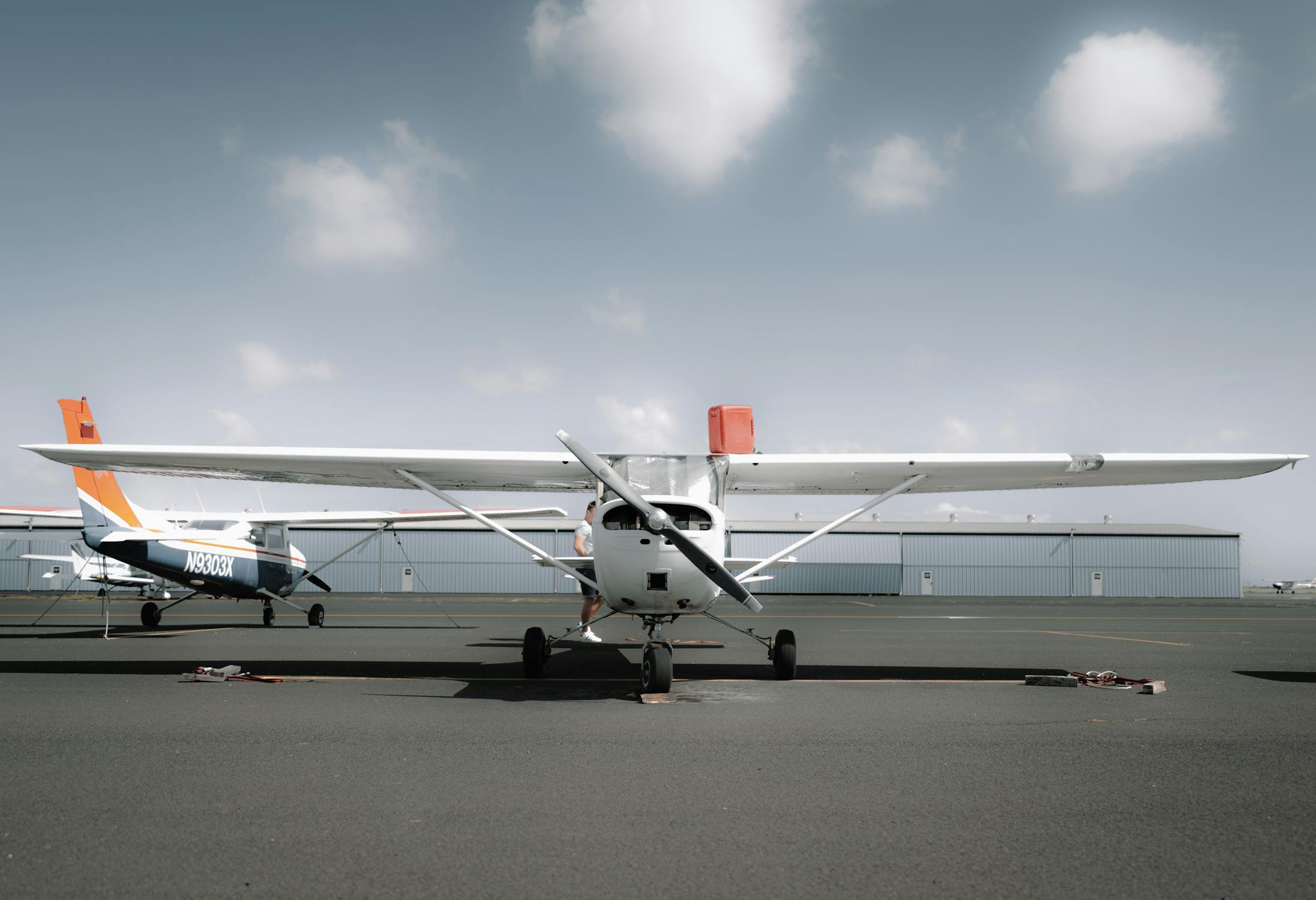 Small twin-propeller aircraft on the tarmac at a Channel Islands airfield
