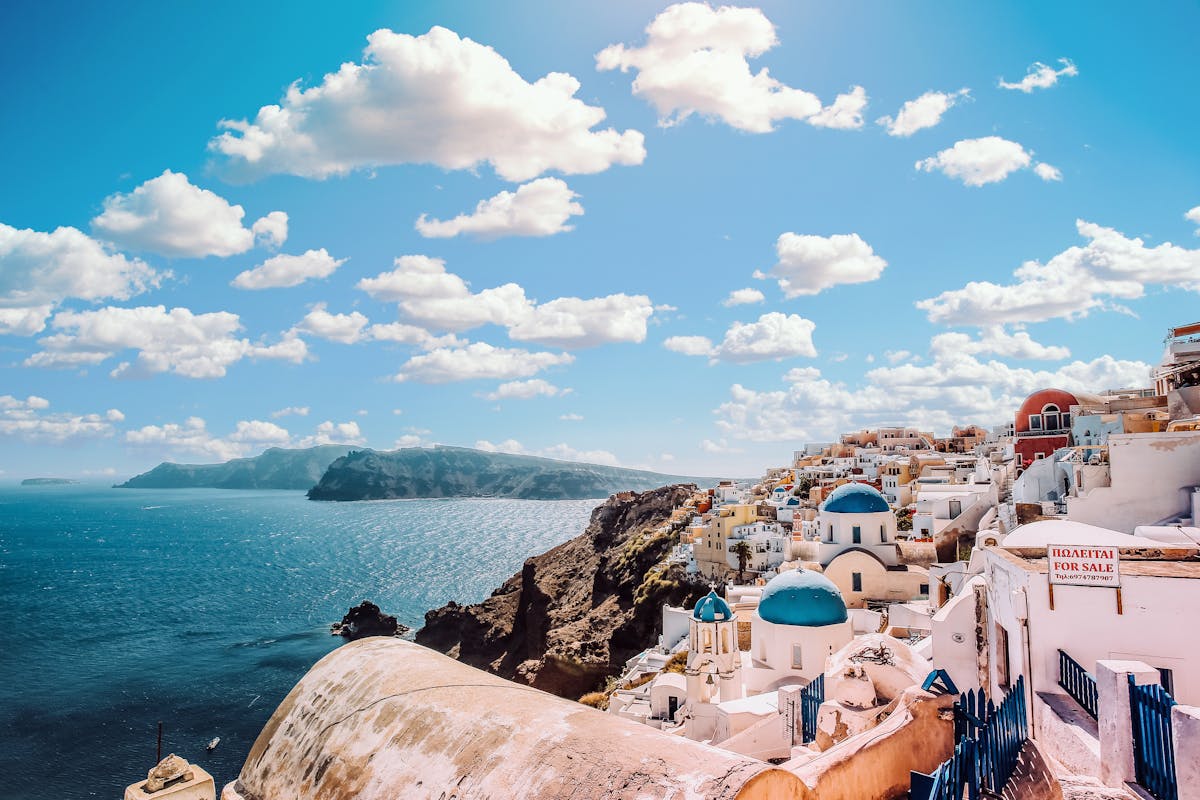 White buildings overlooking blue sea in the Greek islands