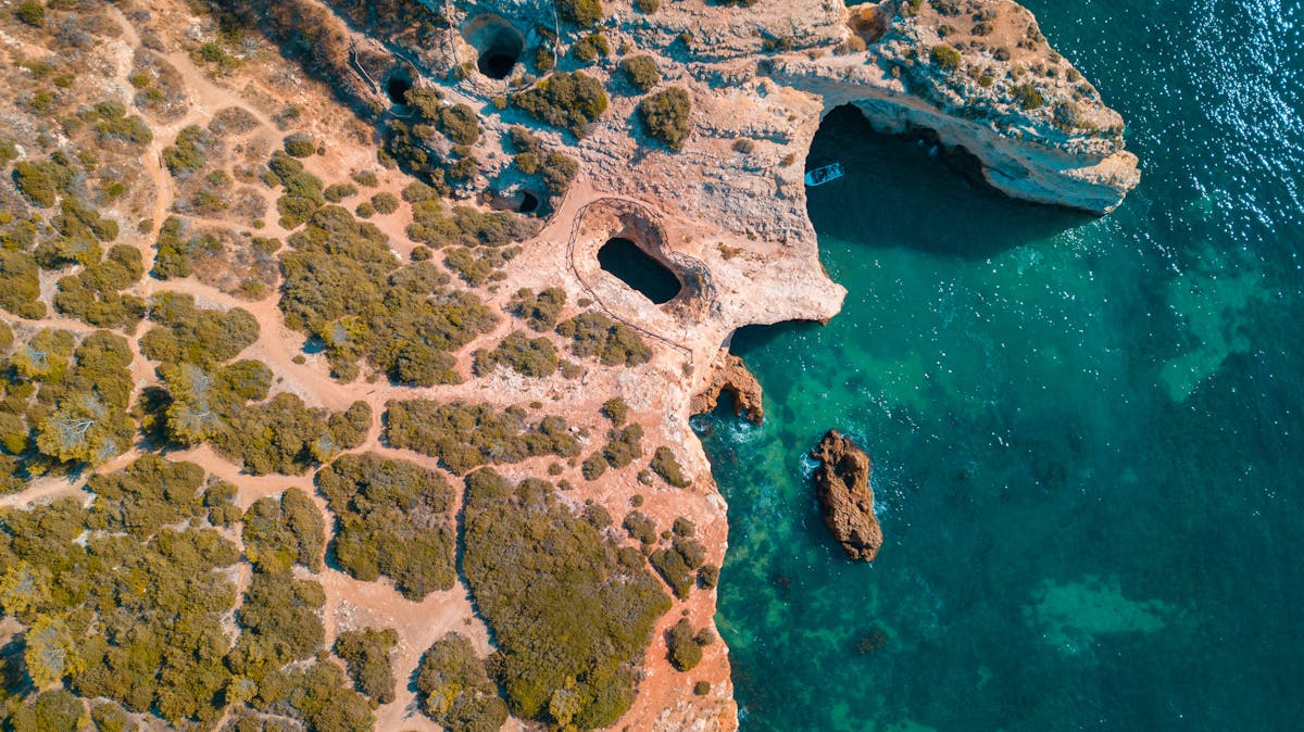 Aerial view of turquoise coves along the Mallorcan coastline