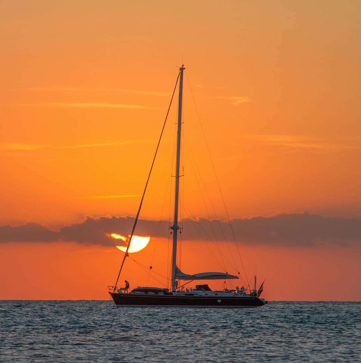 Sailboat on clear blue water