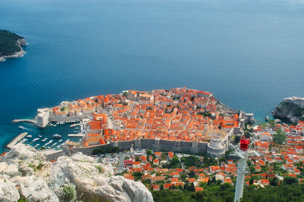 A sailing yacht at anchor in a clear bay on the Dalmatian coast