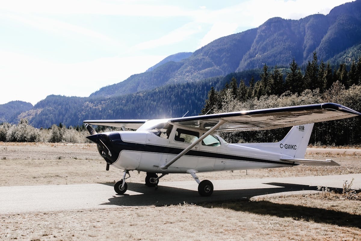 Cessna 172 parked at a mountain airstrip