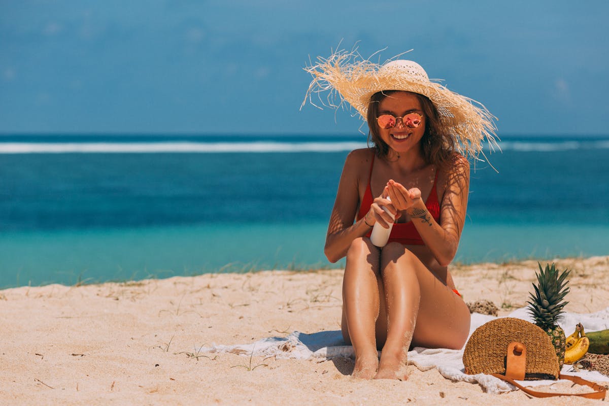 Sunscreen, sunglasses, and a hat on a yacht deck