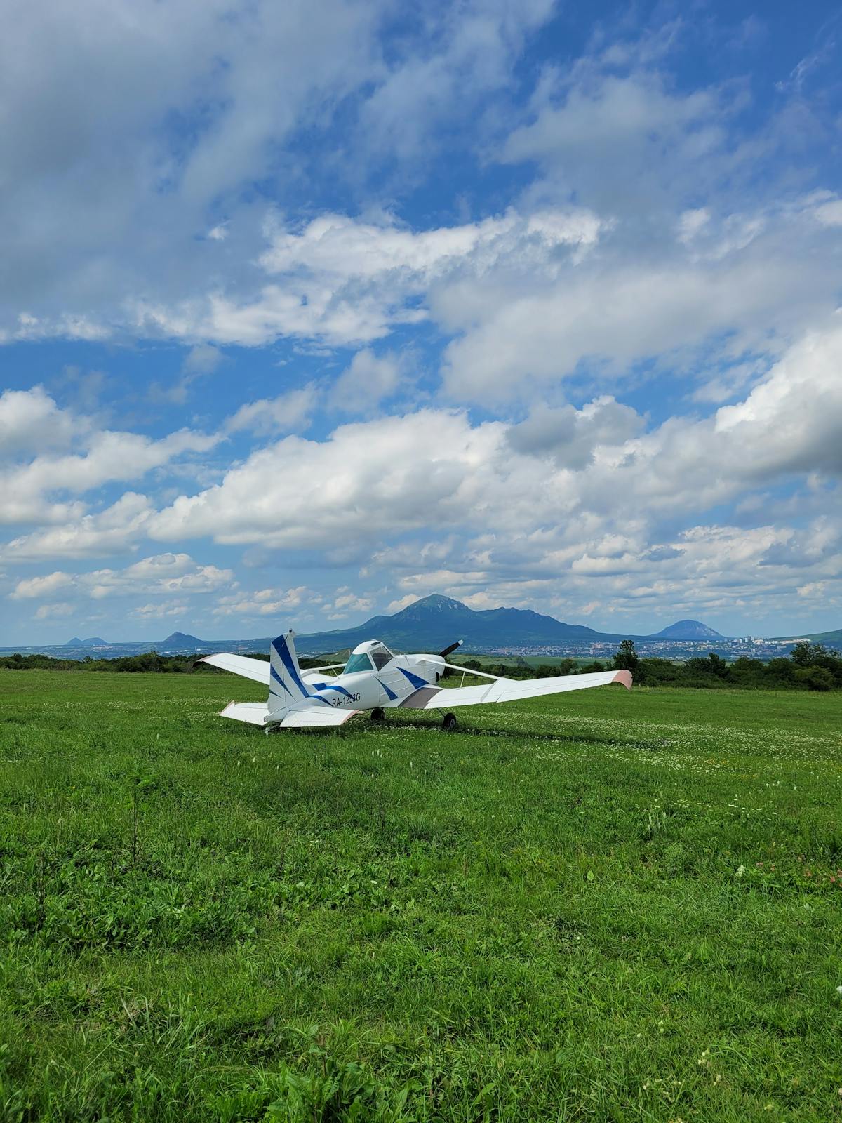 Small aircraft on a grass airfield