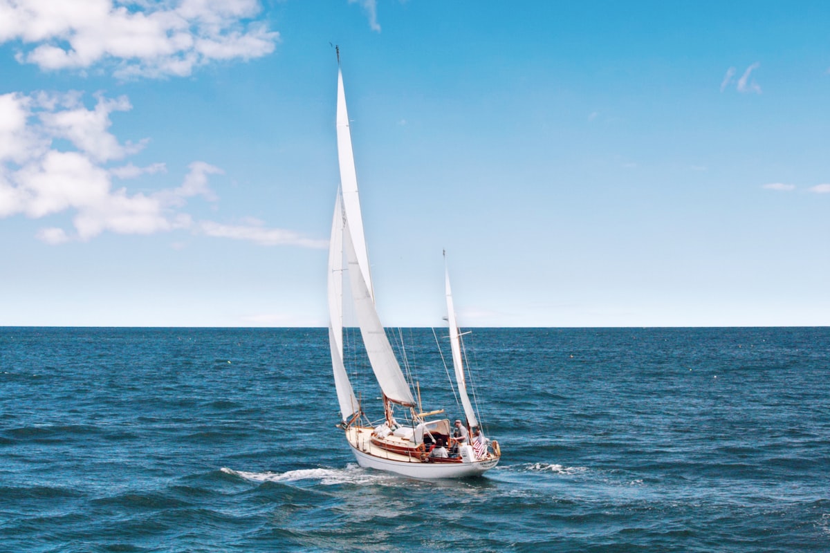 A sailboat under full sail on open water